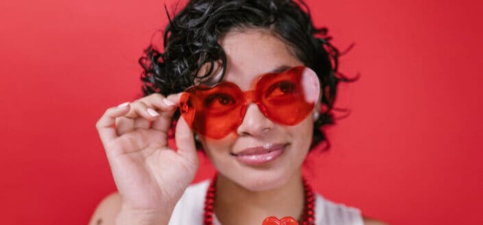 Woman wearing red sunglasses