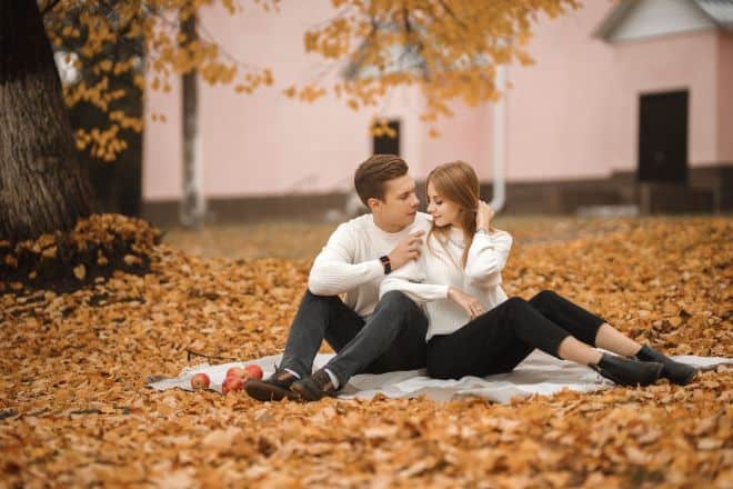 a couple at a picnic - Fall Date Ideas