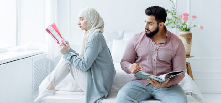 Romantic Couple Sitting on the Bed Reading Books