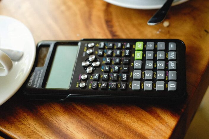 Scientific Calculator on a Brown Table