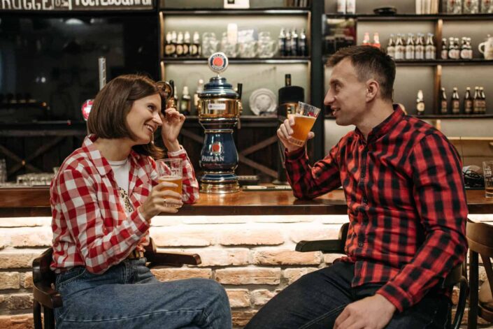 Man and Woman Drinking at the Bar