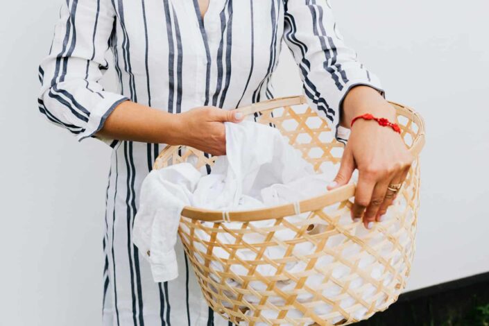 Person Holding a Laundry Basket