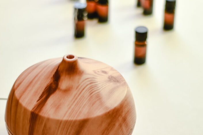 Wooden Oil Diffuser on White Surface