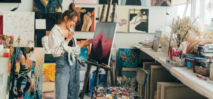A woman painting on her art room
