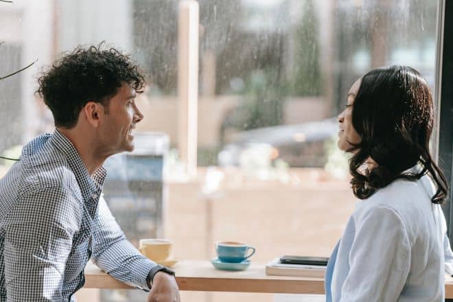 Man and Woman Talking While Having Coffee - Does He Love You