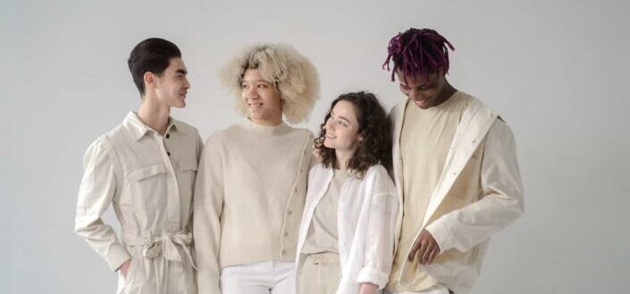 Group of people in beige and white outfits
