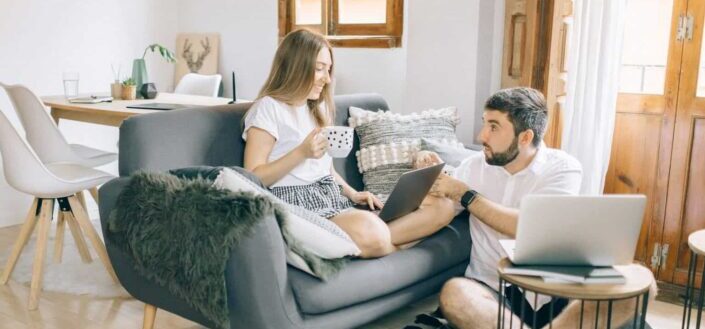 couple talking while working in living room