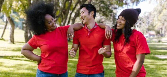 happy friends wearing matching shirts