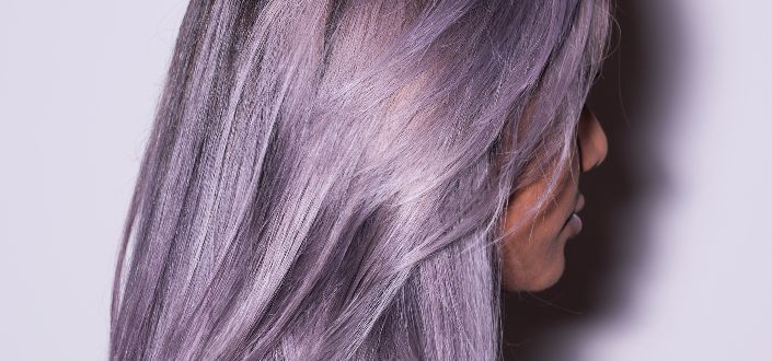 Purple shade hair colored woman